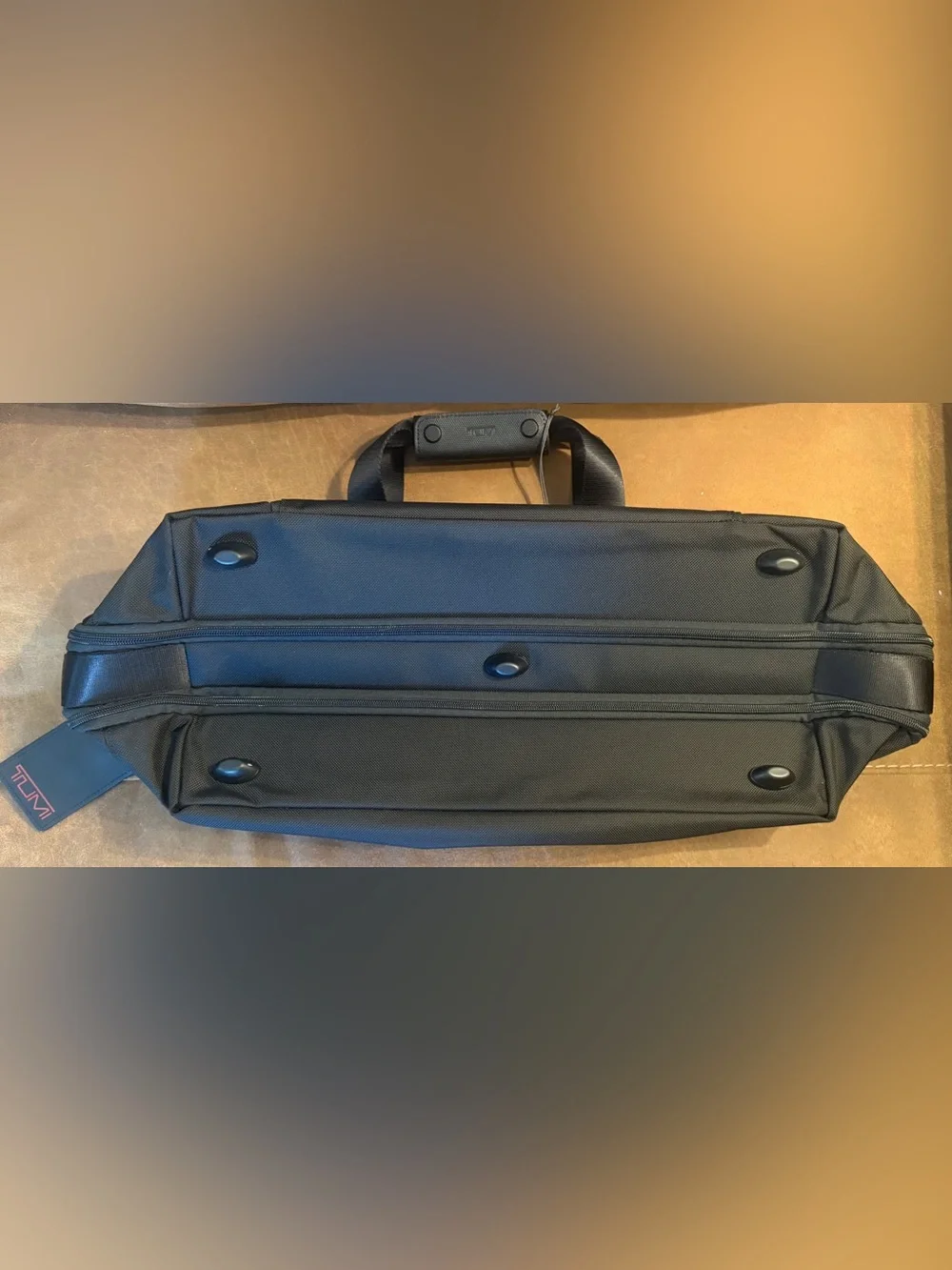 Tumi impressive 13